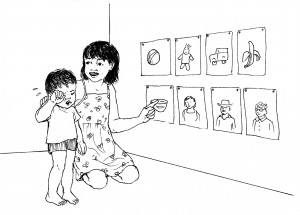 Child showing younger child simple images