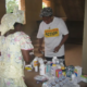 A health volunteer educates about appropriate medicine usage using Hesperian resources.