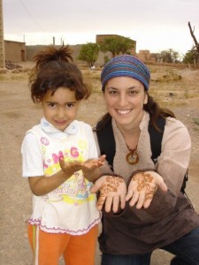 Janelle with a little girl in rural setting