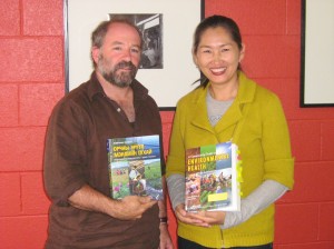 Oyuna Two translation partners holding books