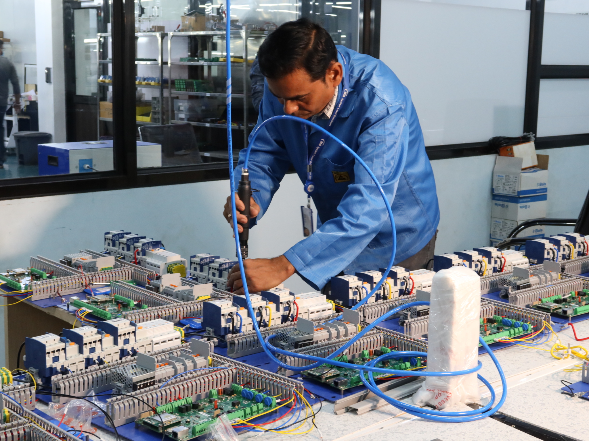 An electronics factory worker doing his job.