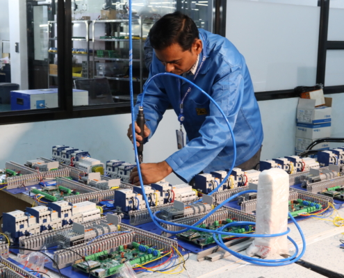 An electronics factory worker doing his job.